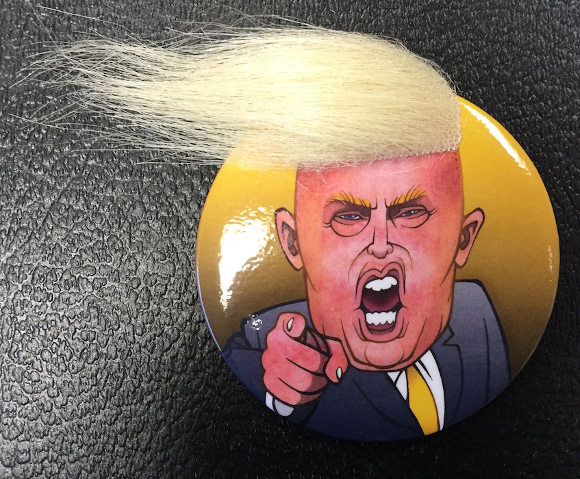 Tipped to become a classic collectible from the 2016 presidential campaign, a Donald Trump ‘crazy hair’ button, which has an estimated value of $20-$50. Image courtesy of Hake’s Americana