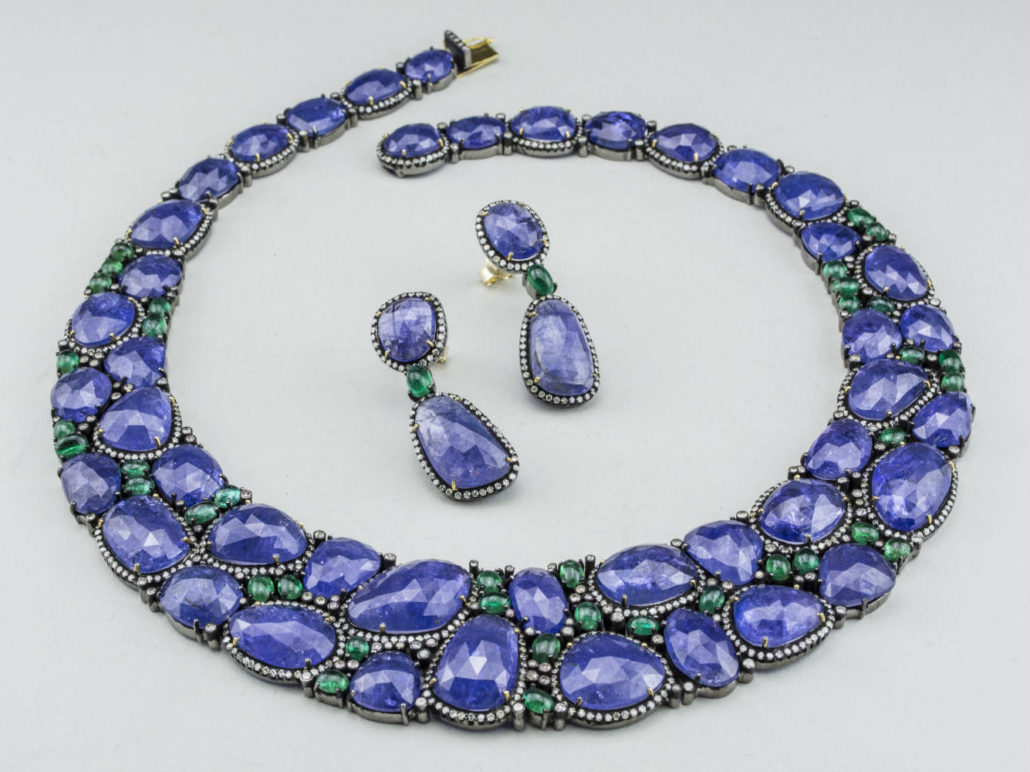 Tanzanite and emerald jewelry suite, 14K blackened gold necklace and earrings suite. Estimated value $8,000-$12,000). Capo Auction image