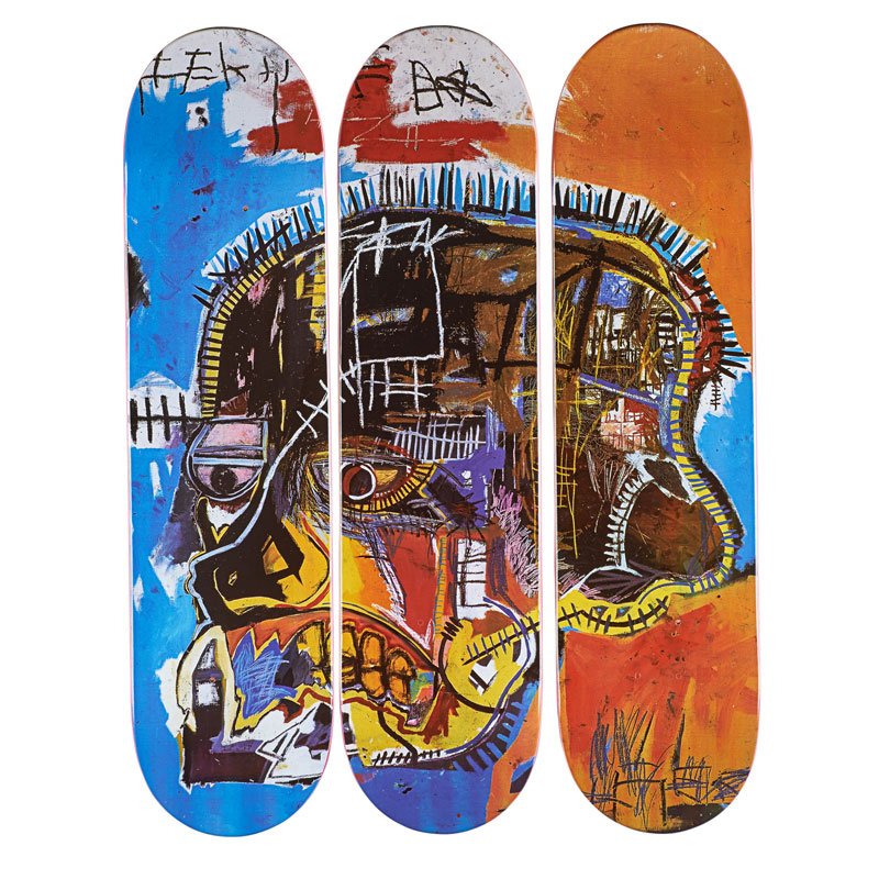 Jean-Michel Basquiat (American, 1960-1988), set of three transfer-printed skateboard decks in original cellophane wrappers.Published by The Skateroom. Estimate: $800-$1,200. Rago Arts & Auction Centerr image