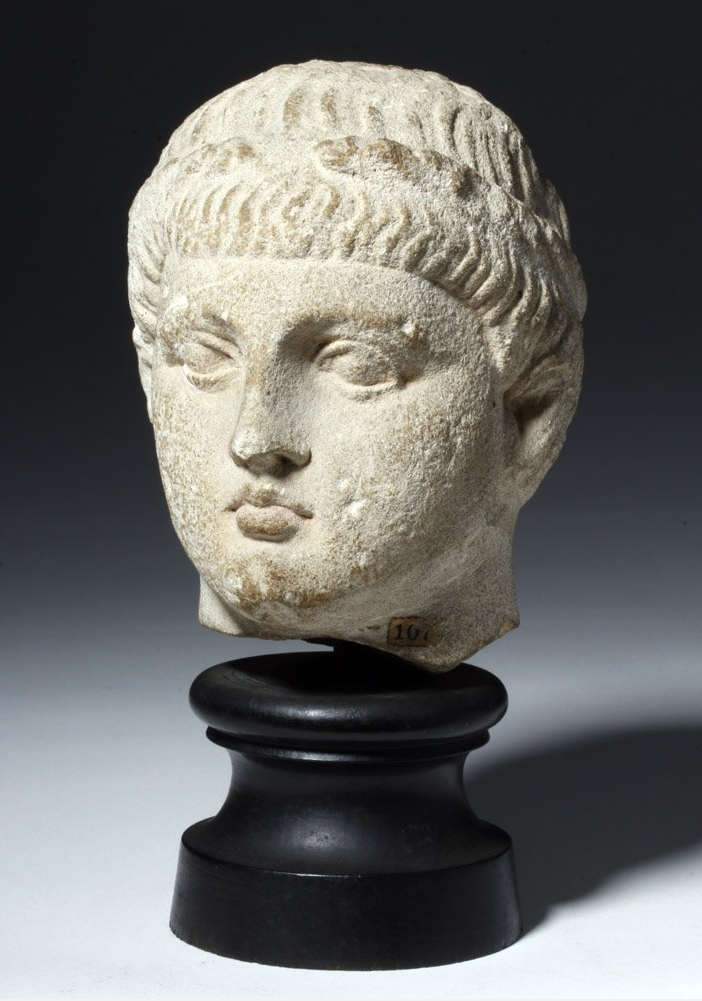 Published Cypriot limestone head of male youth, circa 310 BCE, ex Cesnola collection, Metropolitan Museum of Art, est. $30,000-$40,000