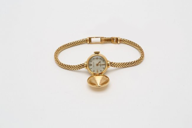 Rolex solid 18K gold cover watch, 1960s, 15mm diameter. Estimate: $3,000-$3,500. Jasper 52 image