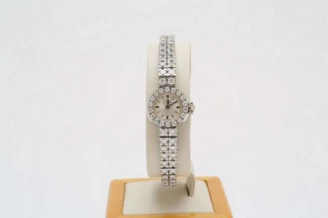Bucherer diamond tennis bracelet watch, 18K gold case. Estimate: $4,000-$5,000. Jasper 52 image