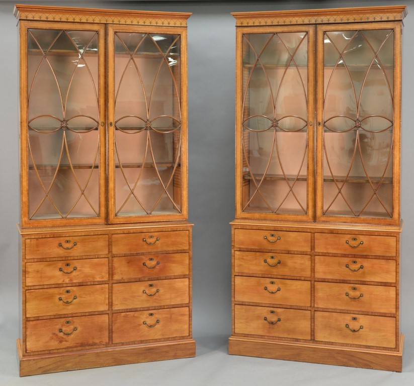 Pair of George III satinwood and tulipwood marquetry bookcase cabinets in two parts, possibly made by Gillows, circa 1790, 92 inches tall (est. $15,000-$25,000). Nadeau’s Auction Gallery