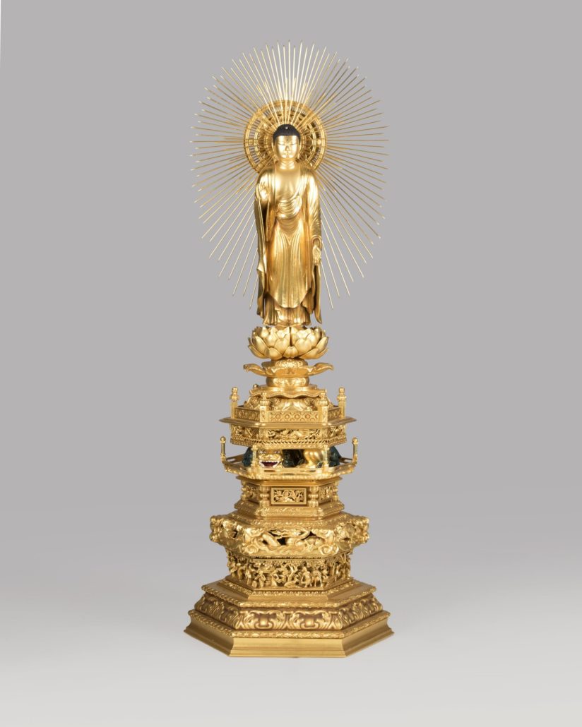 This Japanese giltwood figure of the Buddha brought $15,600 thanks to buyers competing online. John Moran Auctioneers image