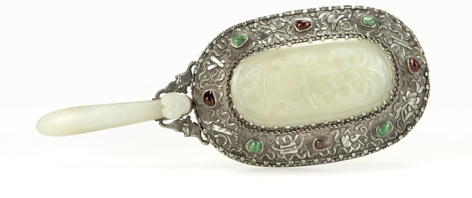 This silver hand mirror exquisitely set with white jade earned $2,040, just over the $1,200 to $1,800 estimate. John Moran Auctioneers image