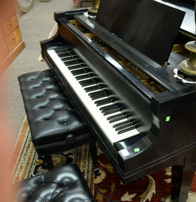 Baldwin 9ft-long ebony concert grand piano with two benches, sold through LiveAuctioneers for $8,125
