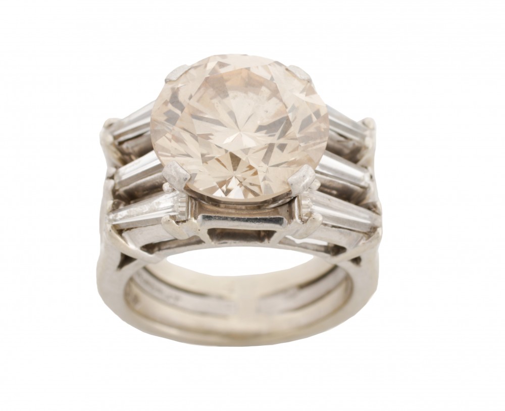 GIA-certified 6.68-carat diamond engagement ring with a 6.68-carat natural fancy light brown round brilliant cut center diamond (est. $40,000-$60,000). Ahlers & Ogletree image