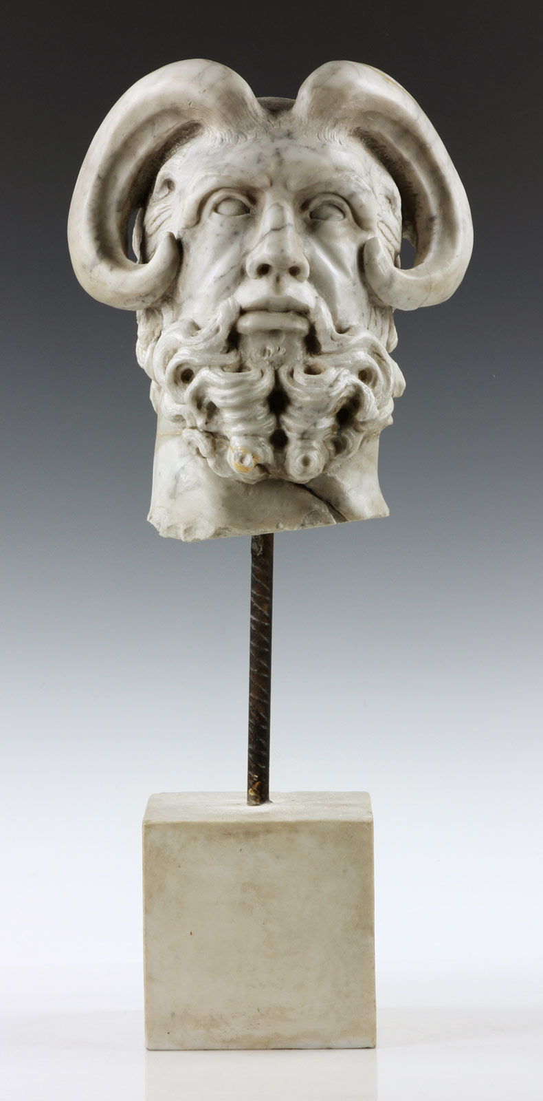 Carved head of a mythological figure. Kaminski Auctions image
