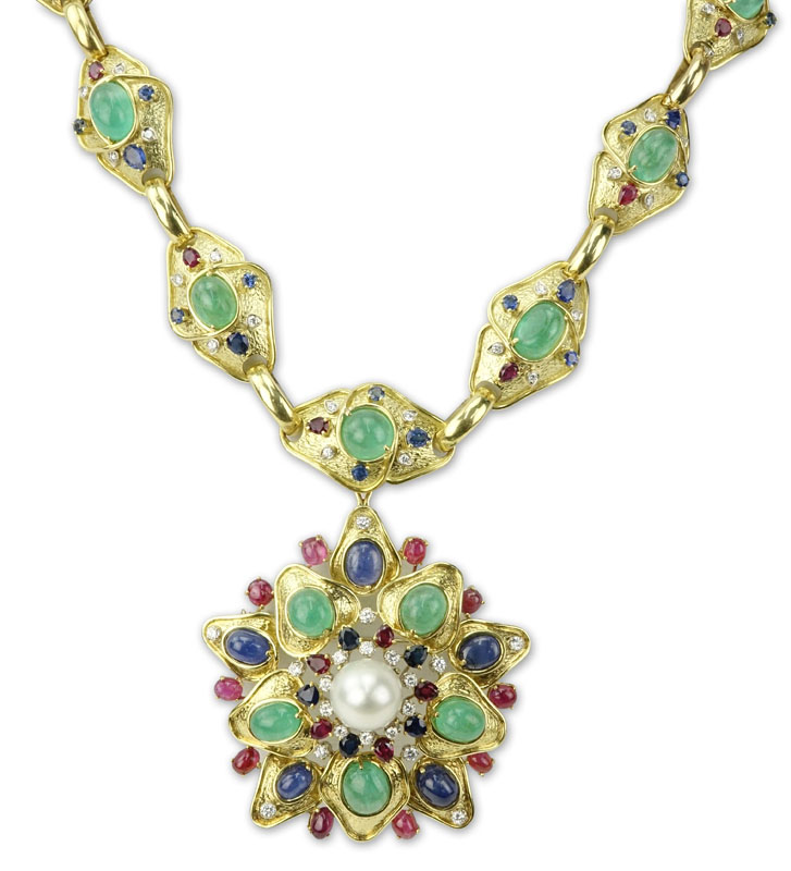 Paul Flato 104.5 carat emerald, sapphire, ruby, diamond, pearl and 18K yellow gold pendant necklace. Price realized: $72,600. Kodner Galleries image 
