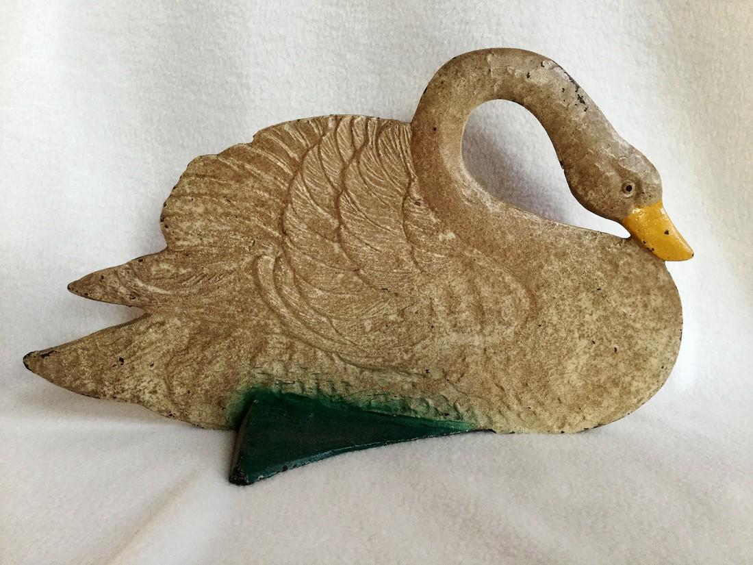 Cast-iron swan doorstop, double sided, made by Spencer, Guilford, Conn., 7 7/8 inches x 13.5 inches. Estimate: $2,700-$3,100. Jasper52 image