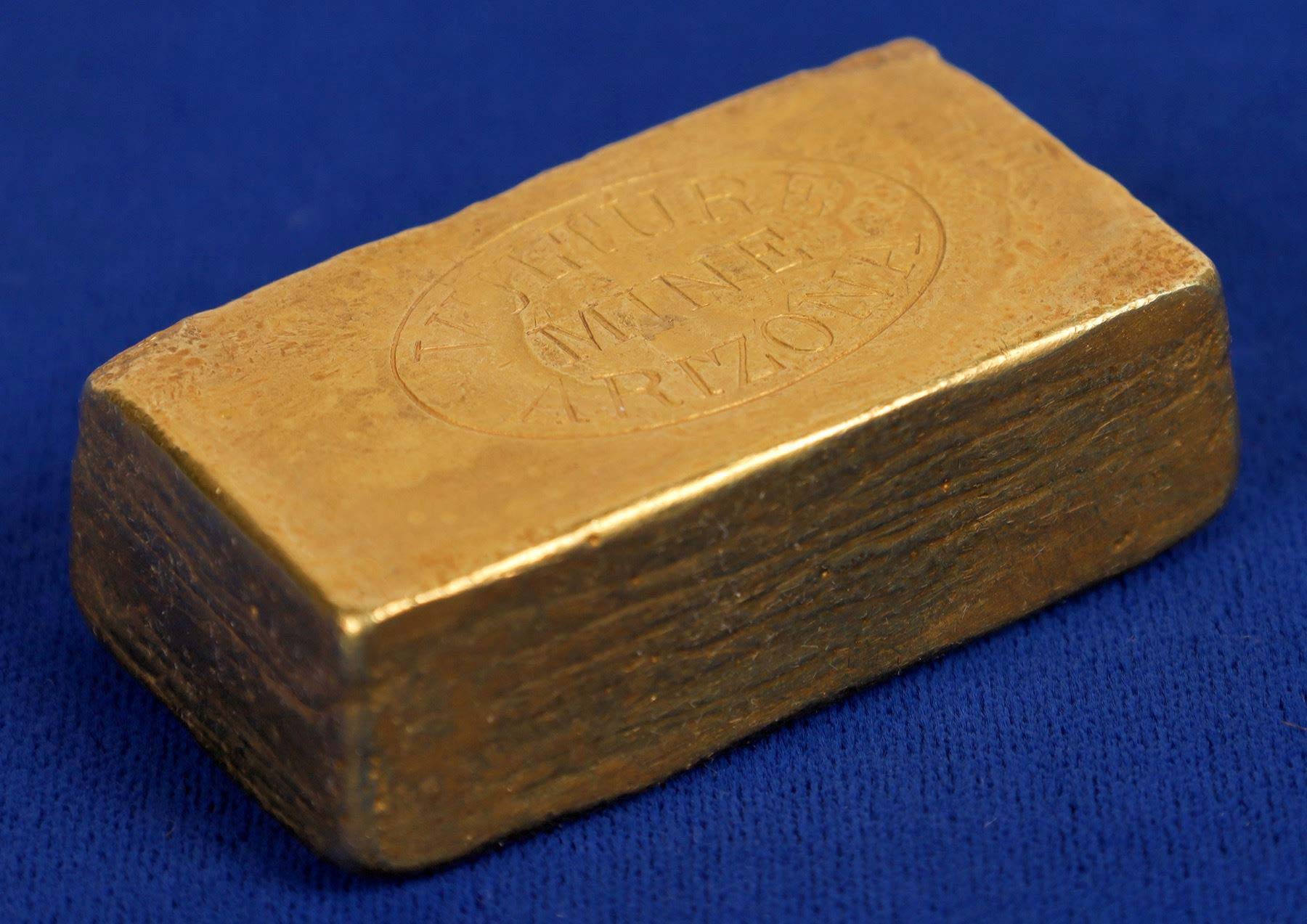 Important discovery gold ingot from the Vulture Gold Mine near Wickenburg, Arizona Territory, circa 1911-14, weighing 391.17 grams, 825 fine gold, with a report copy ($37,355). Image courtesy Holabird Western Americana Auctions and Live Auctioneers.