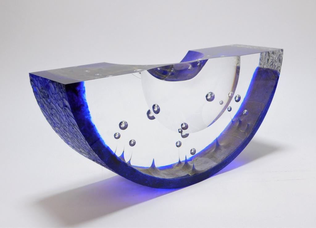 Steven Weinberg untitled polished clear glass cove boat sculpture, with bullicante bubbles wrapped in cobalt blue textured glass, estimated at $6,000-$9,000