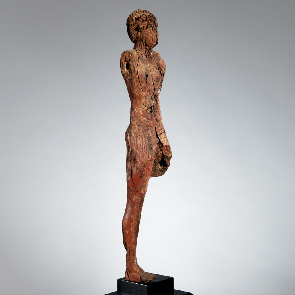 Egyptian Middle Kingdom wooden figure, estimated at $10,000-$15,000
