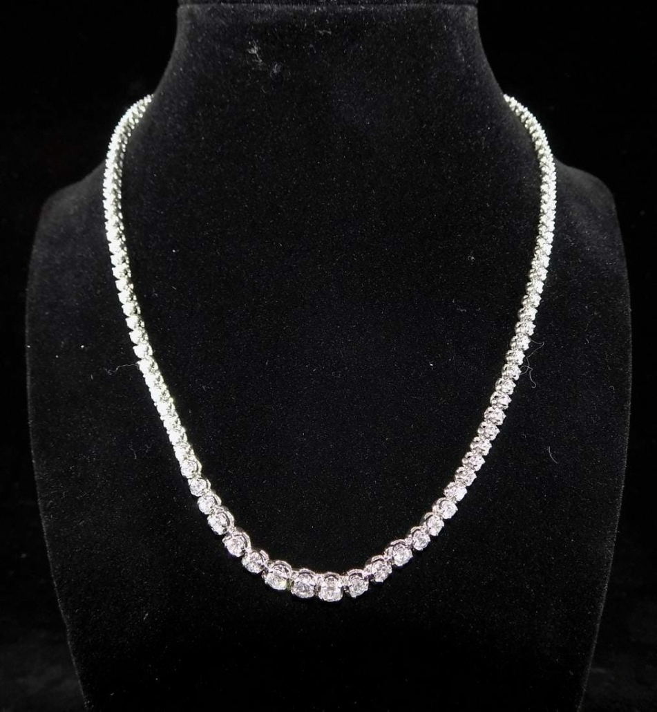 14K white gold and diamond tennis necklace, with a total weight of eight carats, estimated at $5,000-$10,000