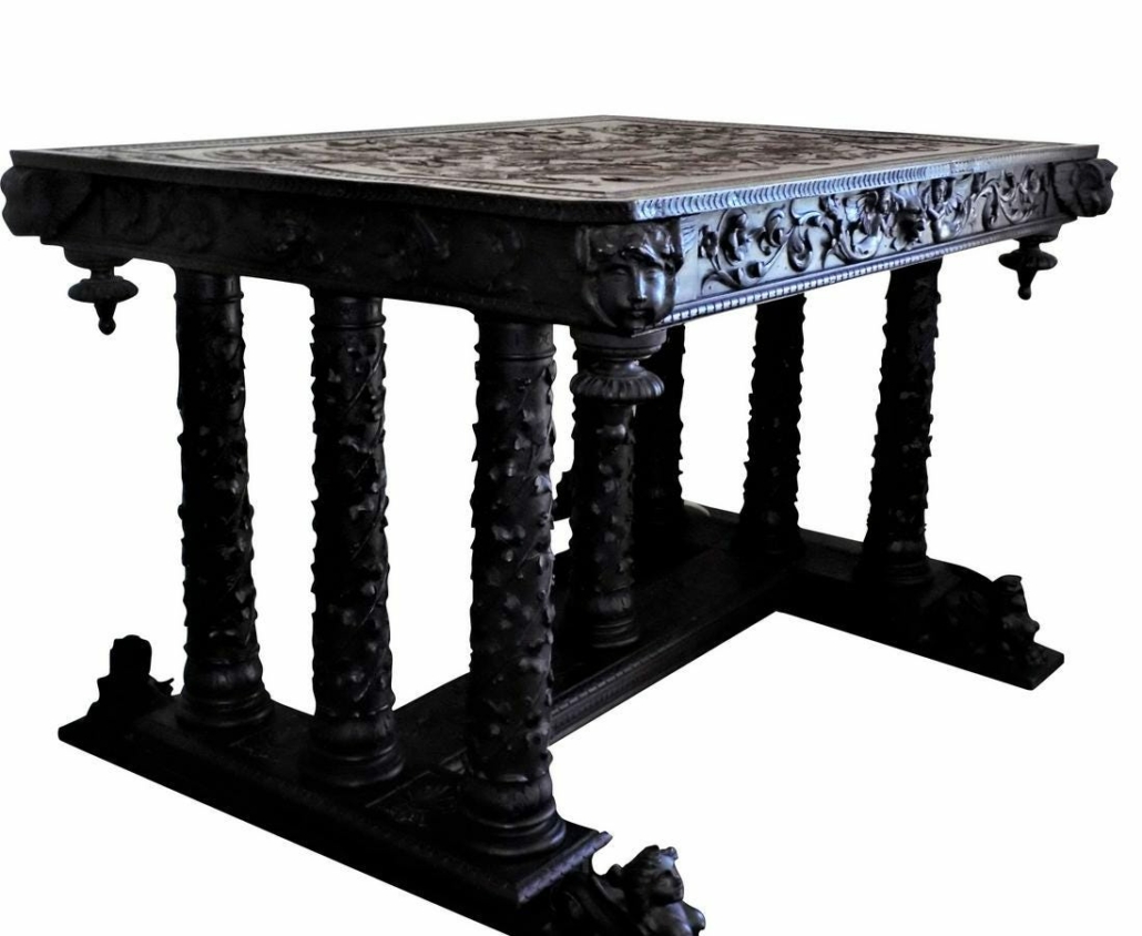 Late 18th century Italian walnut table, carved with Renaissance stylized foliage and grotesques, estimated at $6,000-$12,000