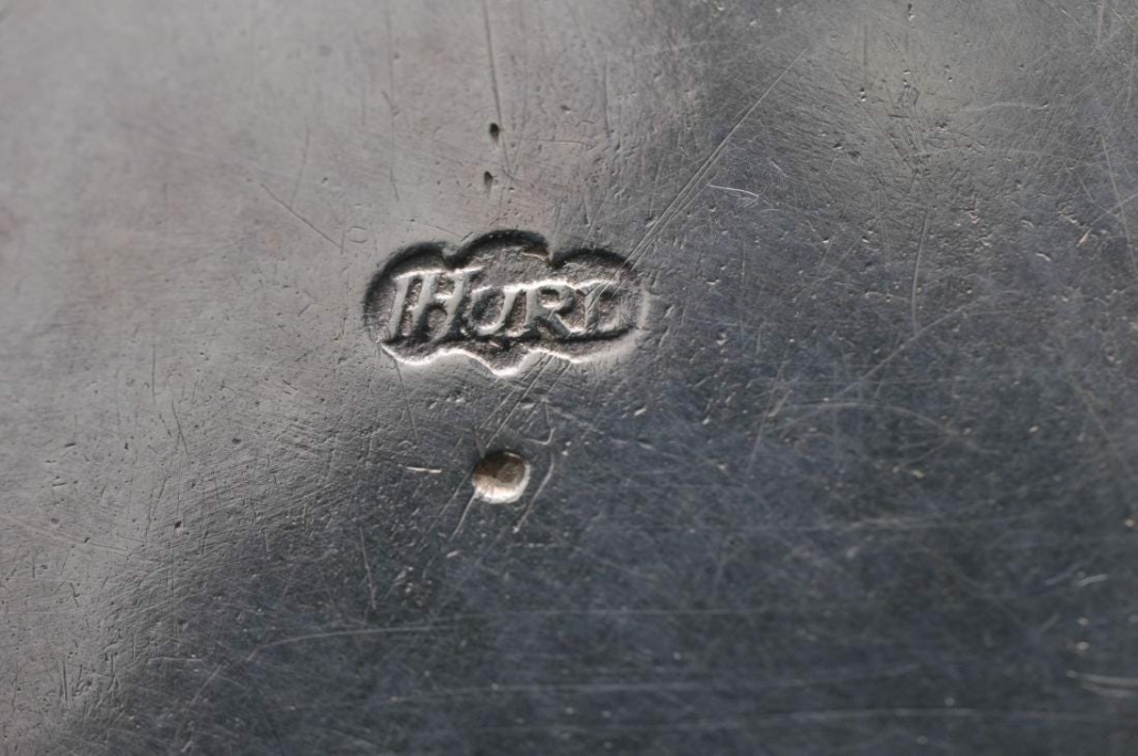 Detail of the hallmark on an 18th century American Colonial silver tankard by Jacob Hurd, which sold for $11,000 plus the buyer’s premium in May 2019 at Tremont Auctions.
