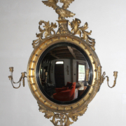 Period Federal gilt framed convex mirror with eagle, estimated at $3,000-$5,000
