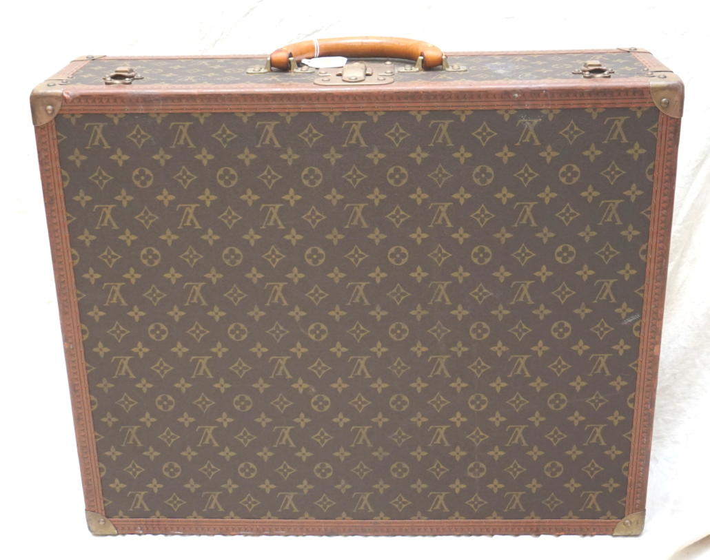 Louis Vuitton hard-sided suitcase, circa 1988, estimated at $700-$900