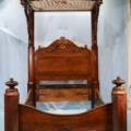 Rosewood rococo half tester plantation bed attributed to P. Mallard, estimated at $8,500-$15,000
