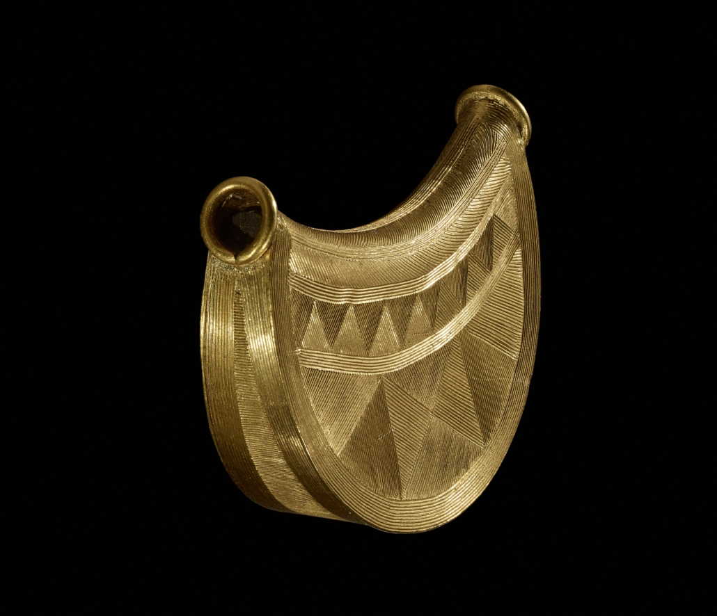Side view of the Bronze Age sun pendant, © The Trustees of the British Museum
