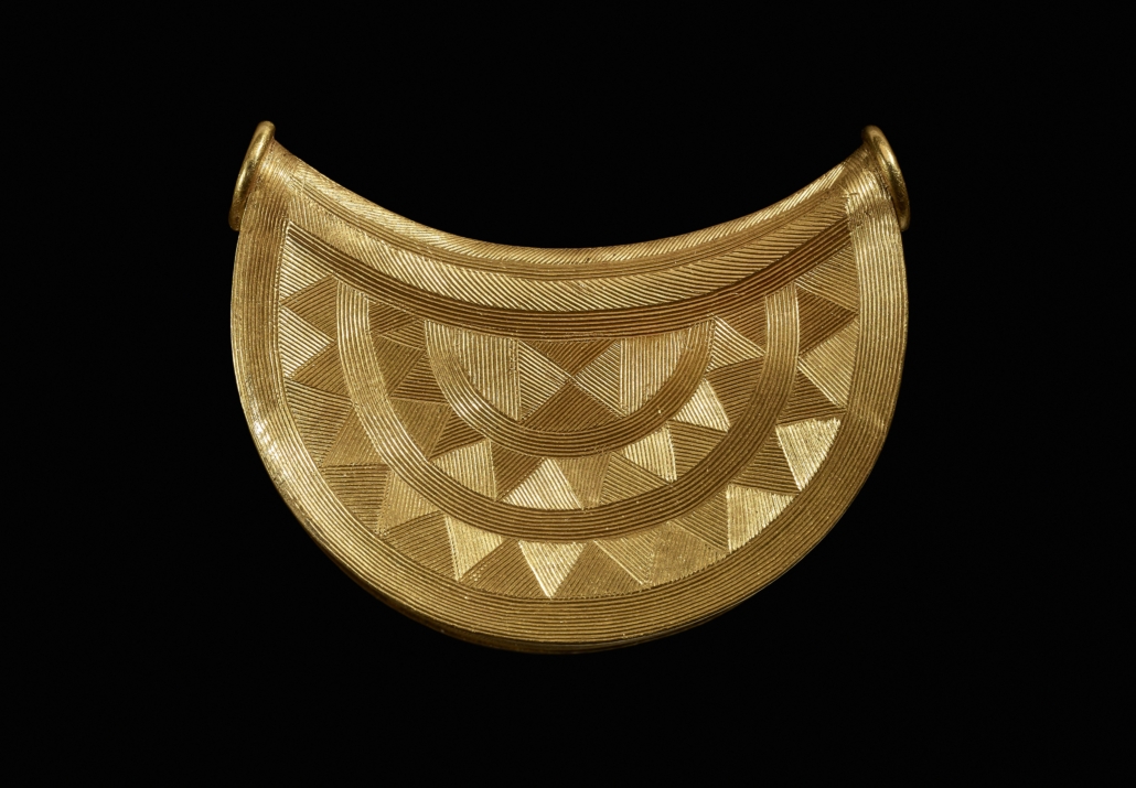 Bronze Age sun pendant, with ornate side shown. © The Trustees of the British Museum