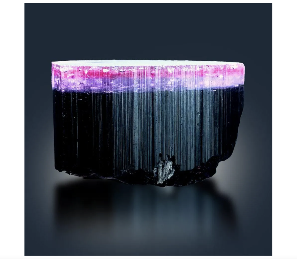 Natural tricolor tourmaline in pink, purple, and black, estimated at $2,500-$3,000