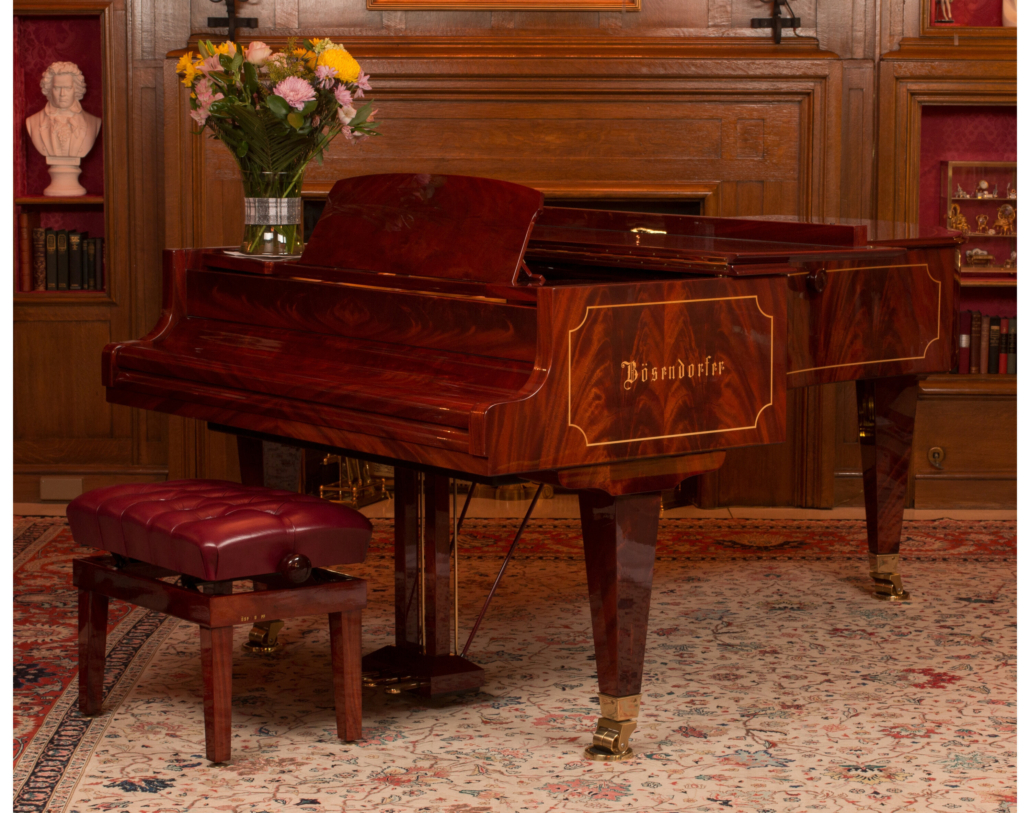 Circa-2000 Bosendorfer Model 225 92-key grand piano with conforming bench, $50,000