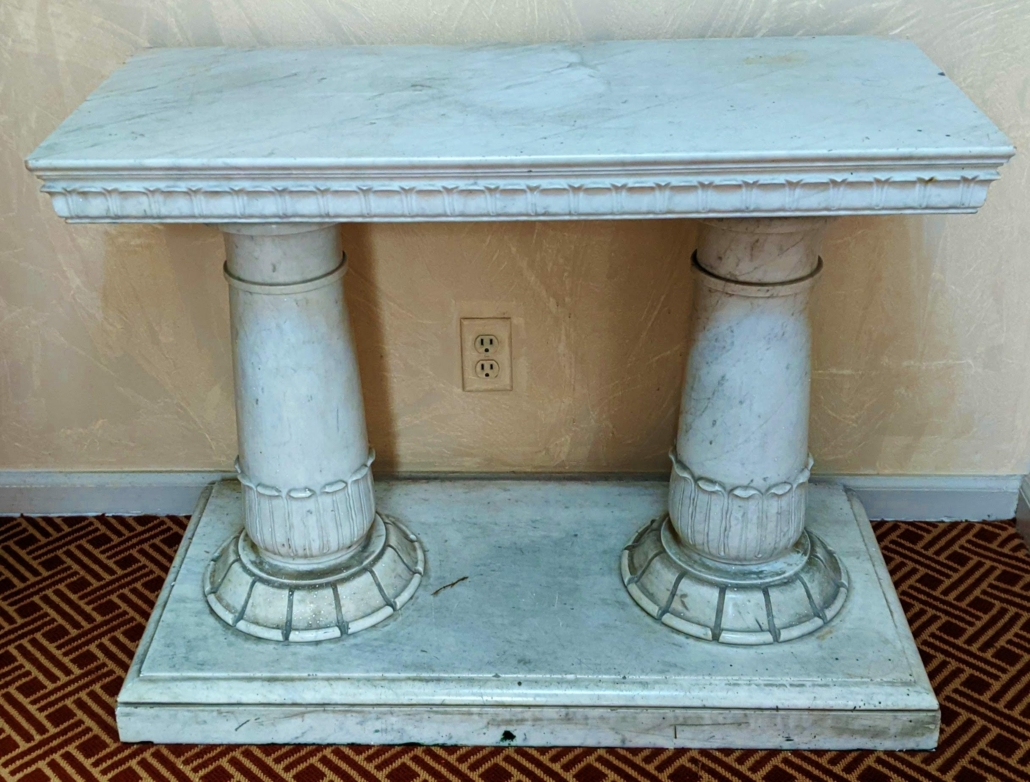 Carrara marble double pedestal console table, $6,250