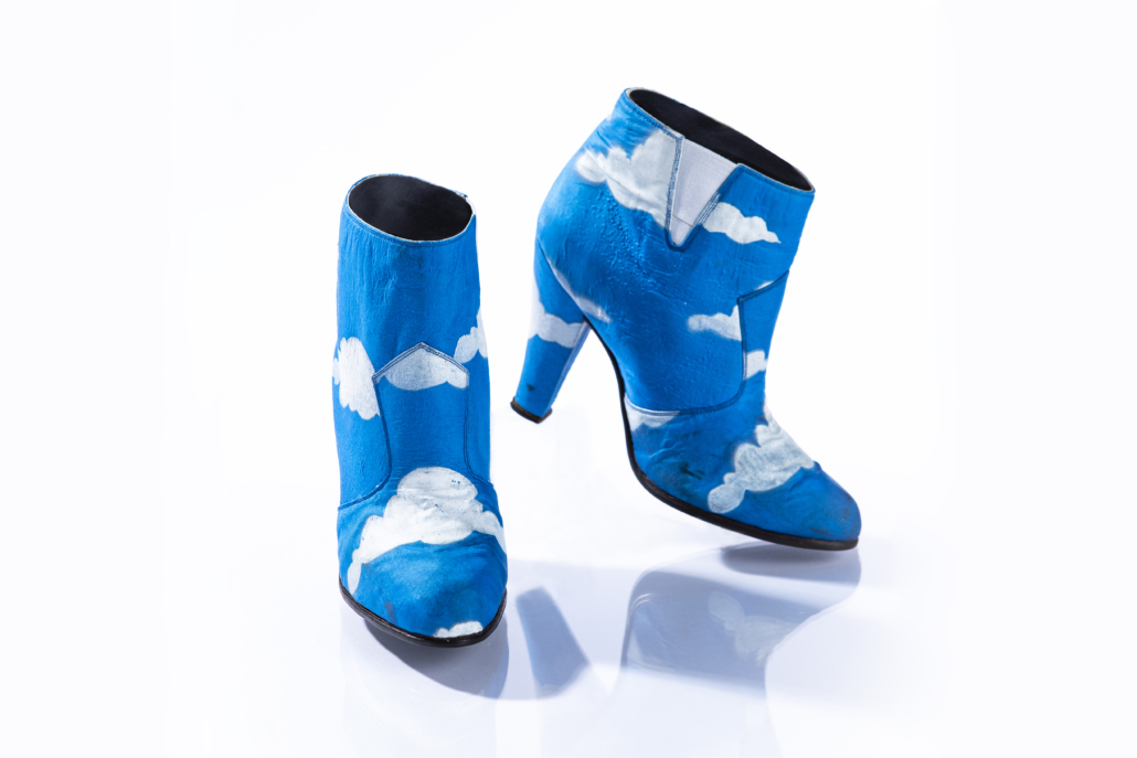 Prince wore these iconic blue ankle boots with hand-painted white clouds in his 1986 Raspberry Beret music video, along with a matching suit. These shoes were made before Prince had his cobblers reinforce his heels, so two identical pairs of the shoes were made for (and survived) the arduous production of the music video. Photo credit: John Wagner Photography © 1985-2021 The Estate of Prince Rogers Nelson. All rights reserved. 