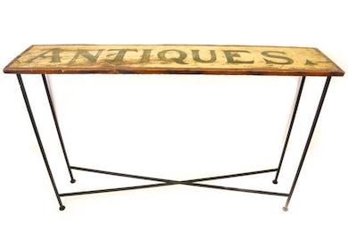 An upcycler transformed a sign into a console table that realized $200 plus the buyer’s premium in June 2021 at Greenwich Auction. Photo courtesy of Greenwich Auction and LiveAuctioneers.