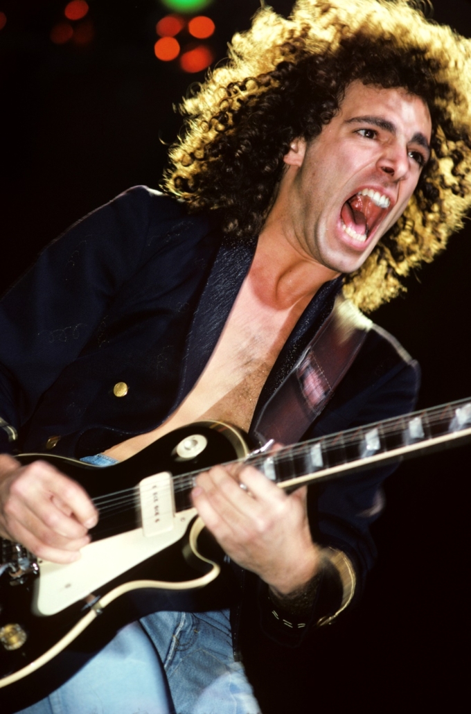 Journey co-founder and guitar collector Neal Schon, shown performing live
