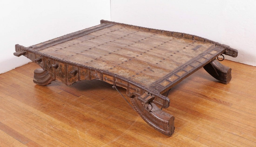 An upcycled coffee table that incorporates the top of a vintage ox cart made $225 plus the buyer’s premium in September 2016 at Burchard Galleries Inc. Photo courtesy of Burchard Galleries Inc. and LiveAuctioneers.