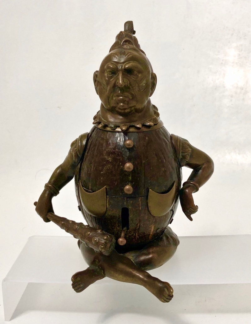 Bronze coconut bell and inkwell in the shape of a Maori warrior, est. $1,000-$2,000