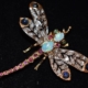 Art Deco 14Kyellow and white gold dragonfly brooch with diamonds, star sapphires, rubies, emeralds and opals, est. $100-$1,000