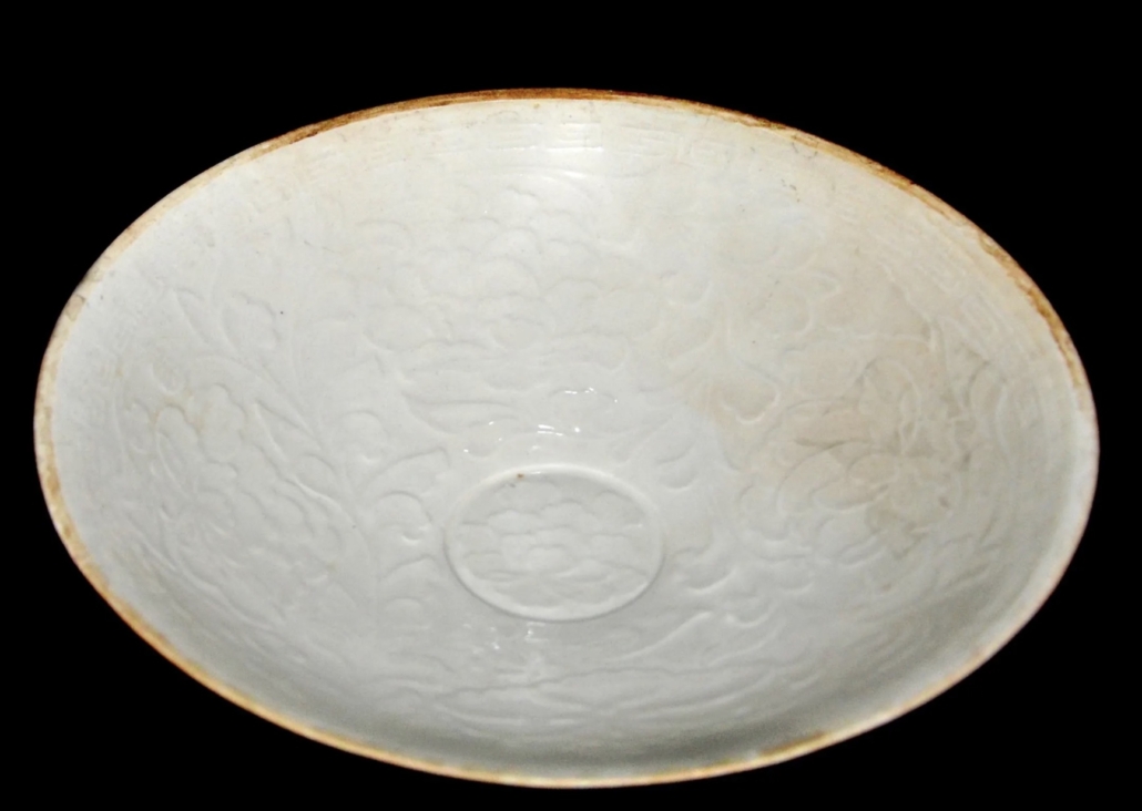 Northern Song dynasty molded Dingyao peony plate, est. $2,000-$4,000