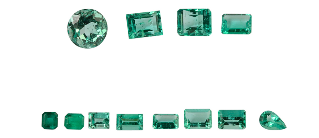 Collection of 13 unmounted emeralds, $9,000