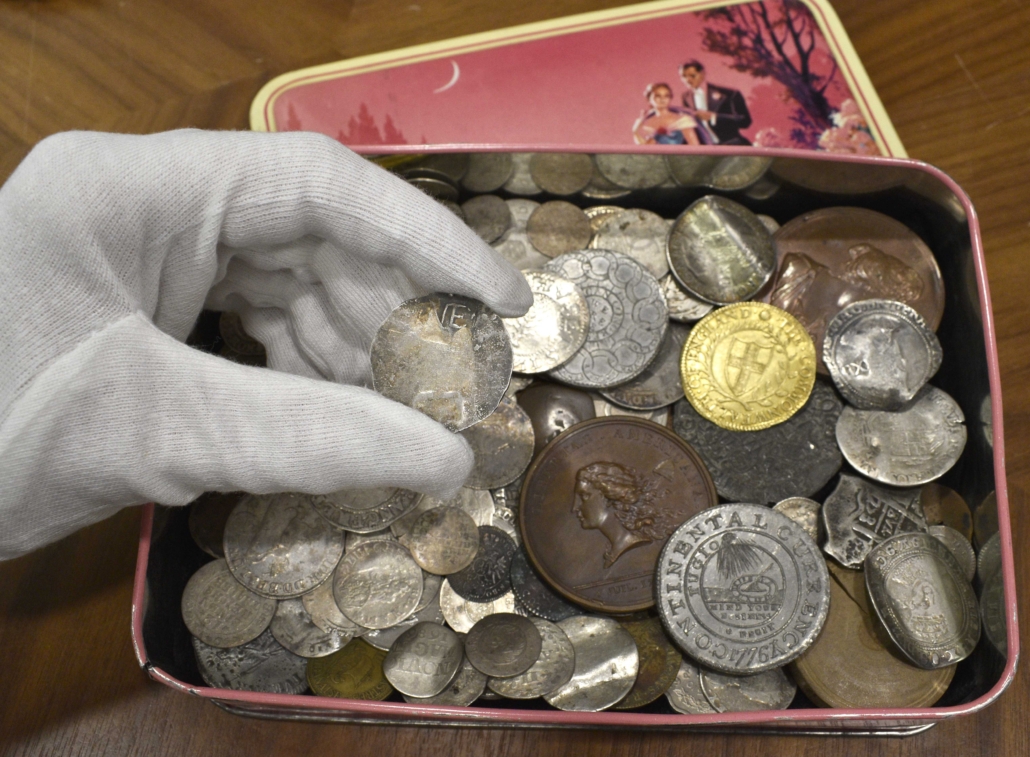 The New England shilling was the most valuable of several notable coins that had been stashed in an old candy tin. Image courtesy of Morton & Eden
