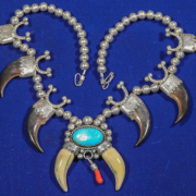Hollow silver bead bear claw necklace with central turquoise cabochon, est. $2,000-$4,000