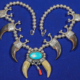 Hollow silver bead bear claw necklace with central turquoise cabochon, est. $2,000-$4,000