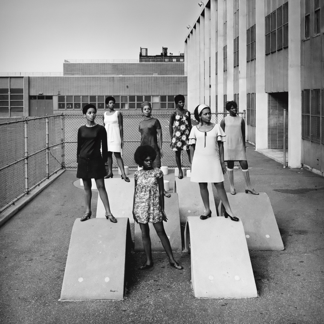 Kwame Brathwaite, Photo shoot at a public school for one of the AJASS-associated modeling groups that emulated the Grandassa Models and began to embrace natural hairstyles. Harlem, ca. 1966; from Kwame Brathwaite: Black Is Beautiful (Aperture, 2019)