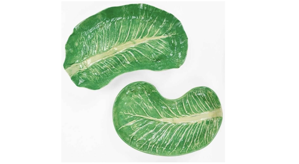 A pair of kidney-shaped plates were among the 35 pieces in a Dodie Thayer lettuce ware set that sold for $4,500 plus the buyer’s premium in April 2021. Image courtesy of Brunk Auctions and LiveAuctioneers