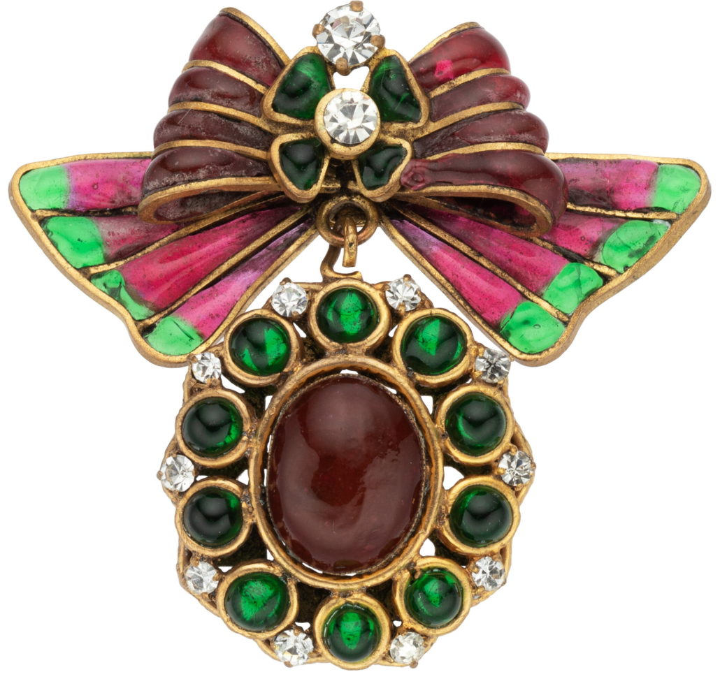 Chanel brooch with red and green Gripoix glass bow motif, est. $2,000-$4,000