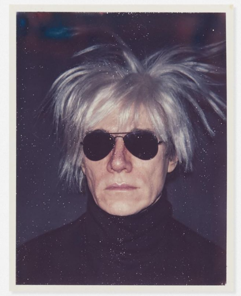 Wearing a fright wig, Andy Warhol pioneered the art of the selfie in a Polaroid that brought $16,000 plus the buyer’s premium in September 2021 at Rago Arts and Auction Center. Image courtesy of Rago Arts and Auction Center and LiveAuctioneers.