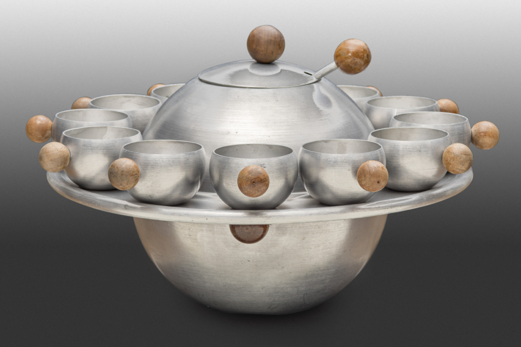 Russel Wright (American, 1904–1976), Saturn punch service, c. 1935. Spun aluminum, lacquered wood handles. New Orleans Museum of Art, Museum Purchase, William McDonald Boles and Eva Carol Boles Fund, 2017.200.a-.o 