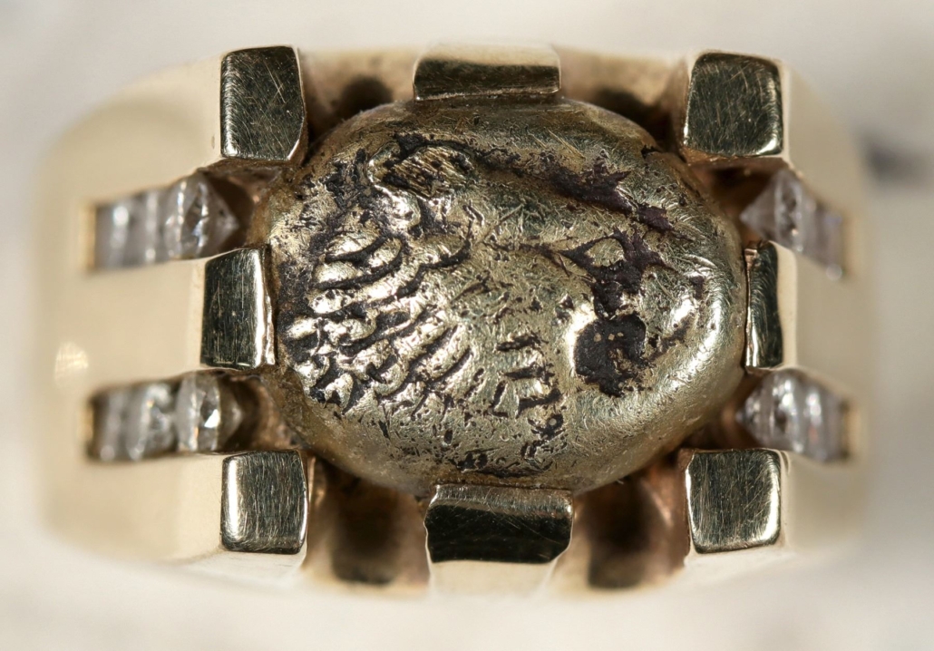 Sixth century BCE ring of one troy ounce of solid 14K gold, featuring diamonds and a gold piece with a lion motif, est. $7,000-$8,500