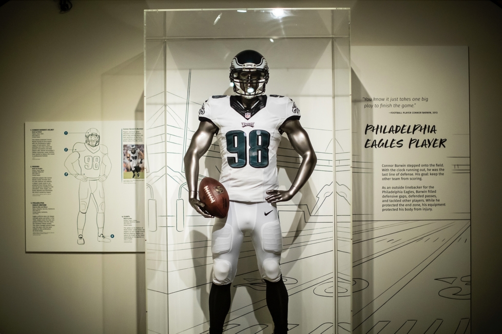 On loan from Connor Barwin, a full Philadelphia Eagles uniform is the MVP of the Work and Play section in The Stories We Wear, now on view at the Penn Museum. Photo credit: Eric Sucar, University Communications