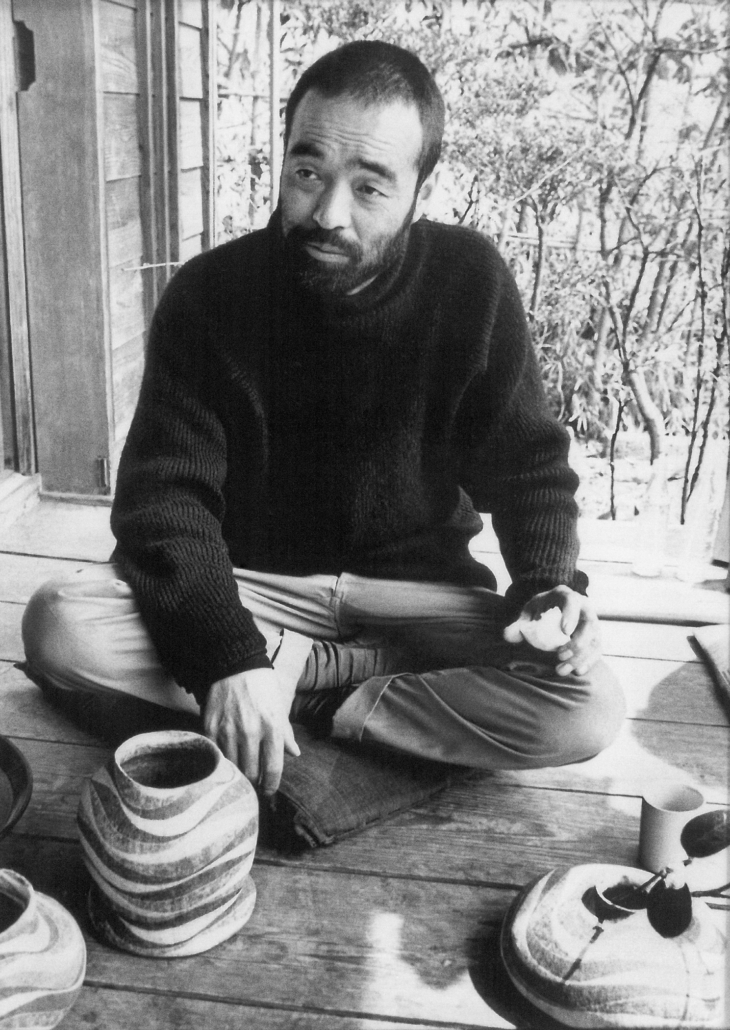 Kamoda at home in Mashiko in 1974 with a jar featuring his trademark red, green and white swirls. Photo credit: Mashiko Museum of Ceramic Art