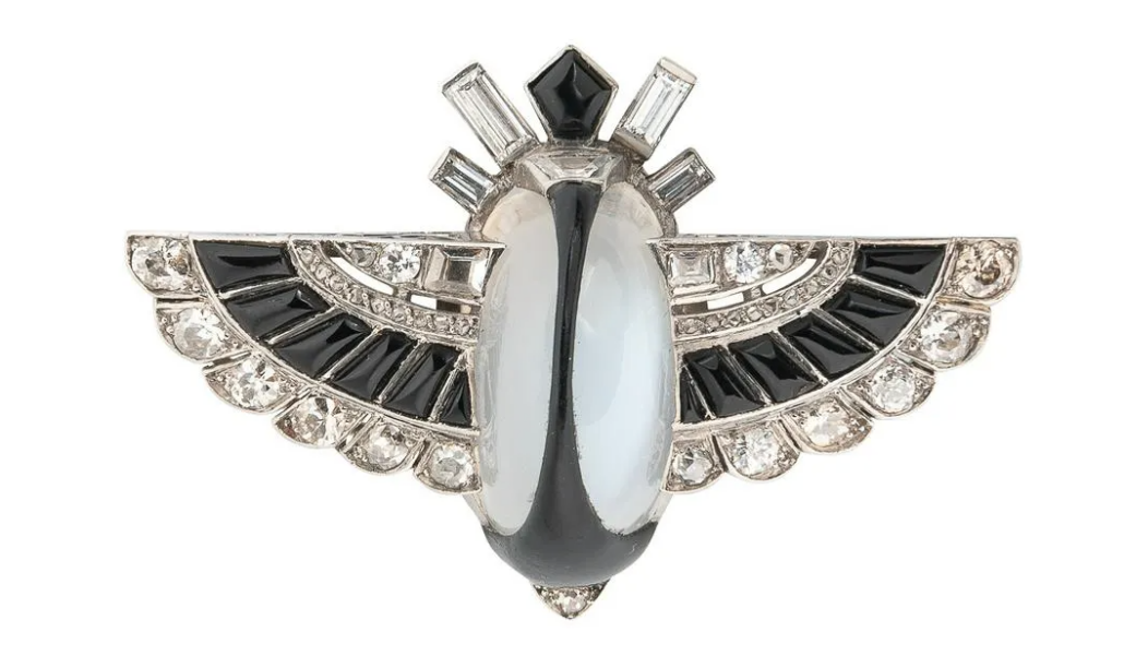 An Art Deco Egyptian Revival moonstone and diamond scarab brooch made $9,500 plus the buyer’s premium in November 2021 at Skinner. Image courtesy of Skinner and LiveAuctioneers