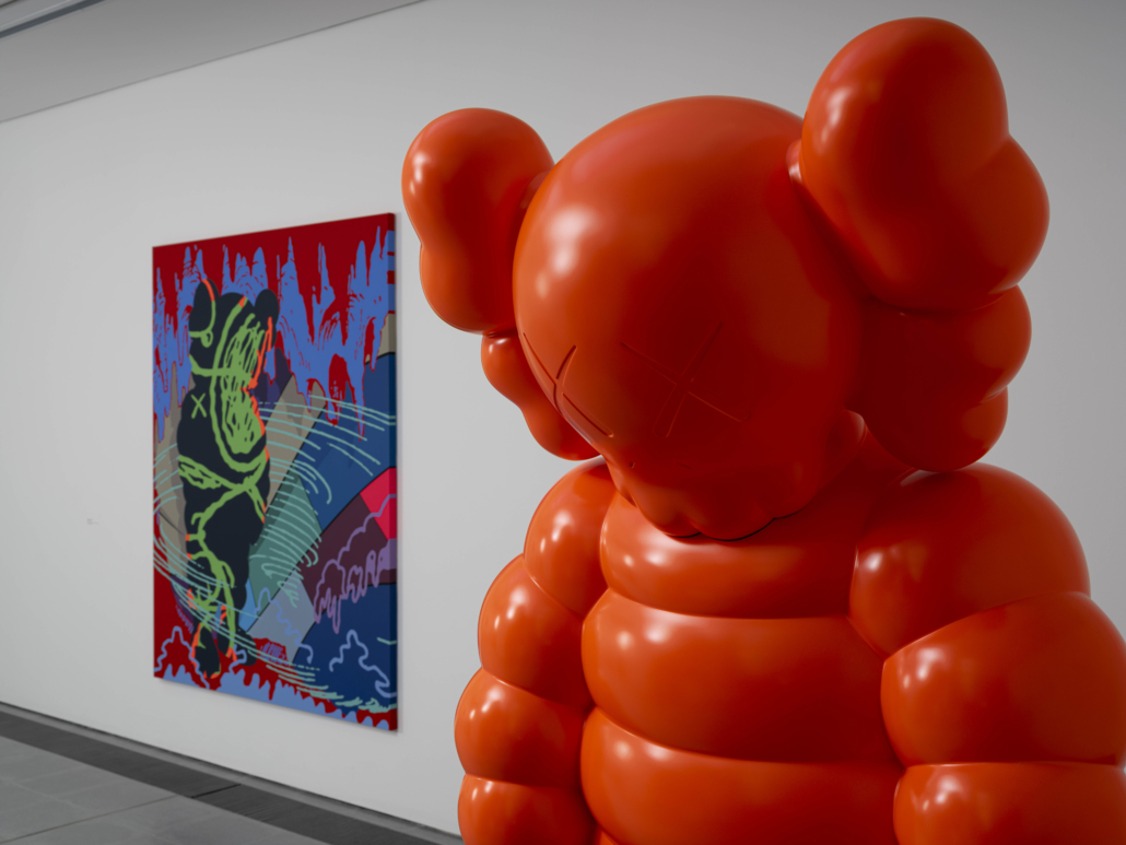 Installation view from KAWS: NEW FICTION at Serpentine, with GETTING THE CALL (2018) and WHAT PARTY (2020) visible. © Jonty Wilde (courtesy KAWS).