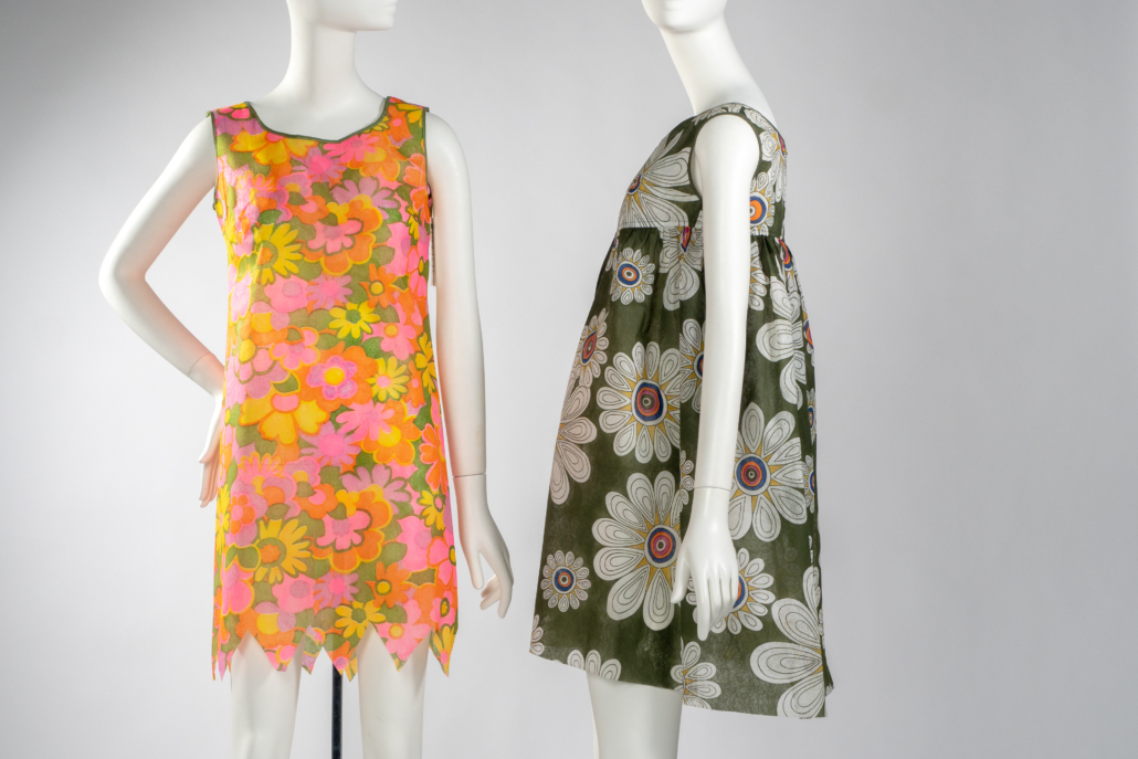 (Left to right) Misty Modes, ‘Daisy Mae’ shift, 1960s. Printed Du Pont Reemay spunbonded polyester. Collection of Phoenix Art Museum, promised gift of Kelly Ellman. James Sterling Paper Fashions, dress, 1960s. Printed Du Pont Reemay spunbonded polyester. Collection of Phoenix Art Museum, promised gift of Kelly Ellman. Image © Phoenix Art Museum.